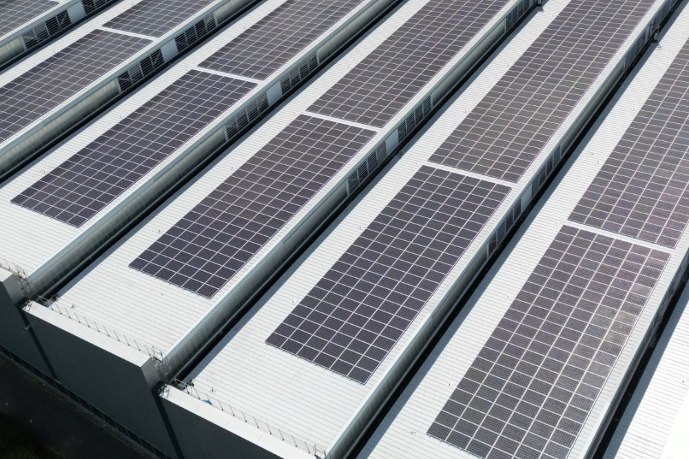 Large manufacturing plant with PV system on roof, UK